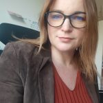 a woman in glasses